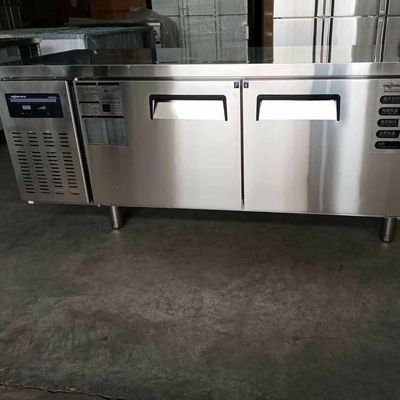 Stainless steel commercial refrigerator workbench in the back kitchen of hotel restaurant